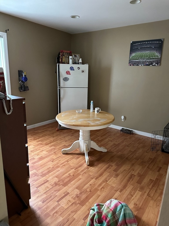 166 Bradford Avenue Fall River, MA 02721 - Photo 18 of 28 a room with a wooden floor and furniture