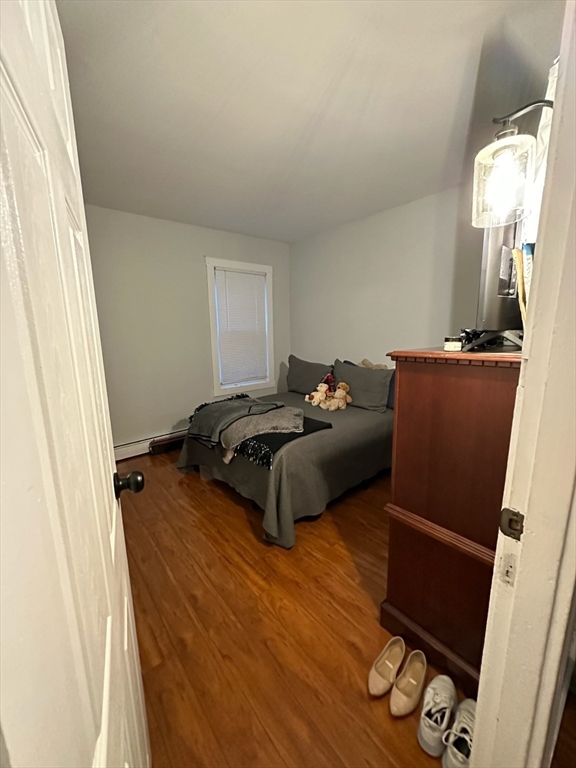 166 Bradford Avenue Fall River, MA 02721 - Photo 22 of 28 a bed room with a bed window and a mirror