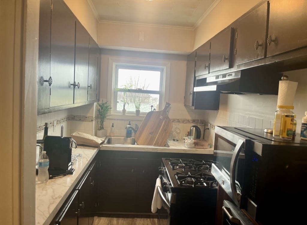 166 Bradford Avenue Fall River, MA 02721 - Photo 28 of 28 a kitchen with a sink appliances and cabinets
