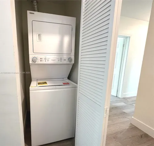 a close view of a utility room with washer and dryer