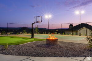 1141 East Lost Ridge Drive Washington, UT 84780 - Photo 18 of 108 Outdoor sports court featuring a basketball hoop, perimeter fencing, and dedicated lighting