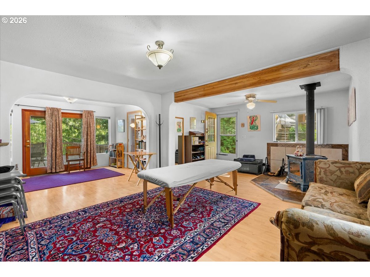 772 Division Street Oregon City, OR 97045 - Photo 9 of 47 a living room with furniture and a large window
