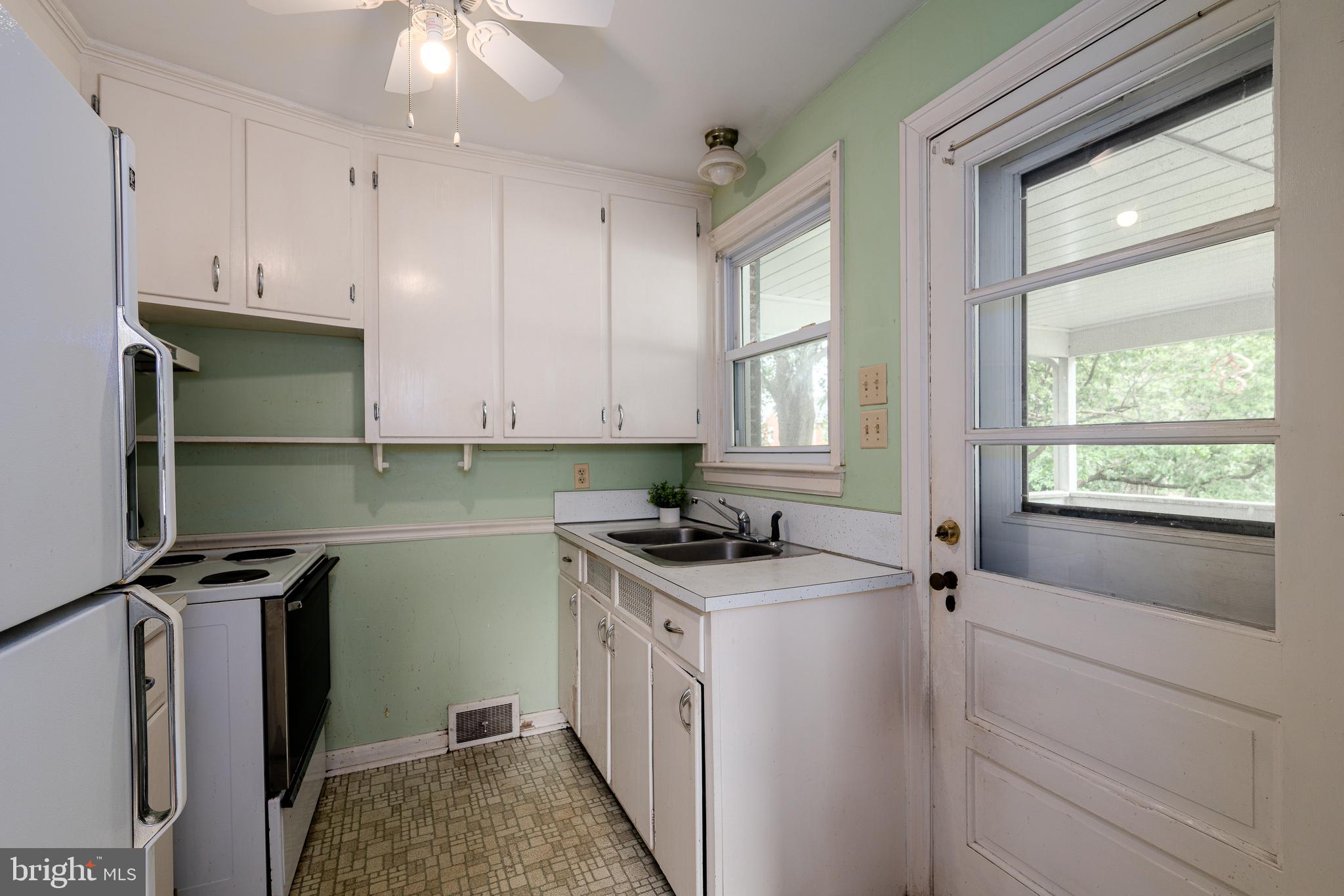 2 Norva Avenue Frederick, MD 21701 - Photo 11 of 36 a kitchen with a stove a sink and a window