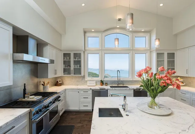 a kitchen with a stove oven and a refrigerator