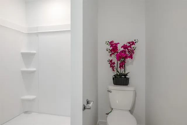 a bathroom with a toilet and a sink