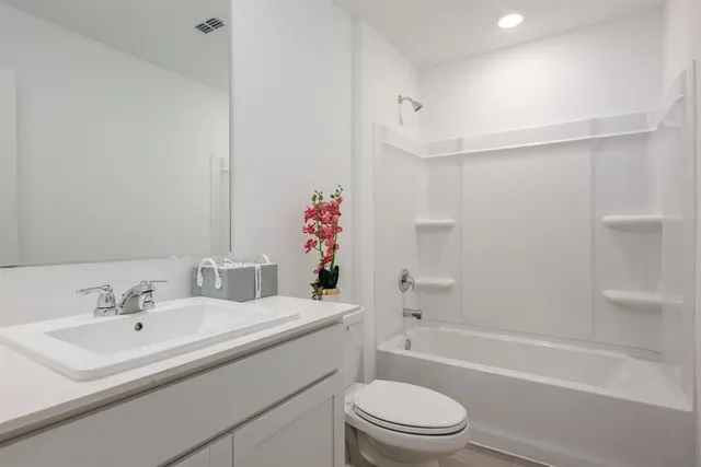 a bathroom with a sink toilet and a bathtub