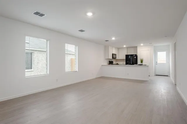 a view of a kitchen with furniture and a window