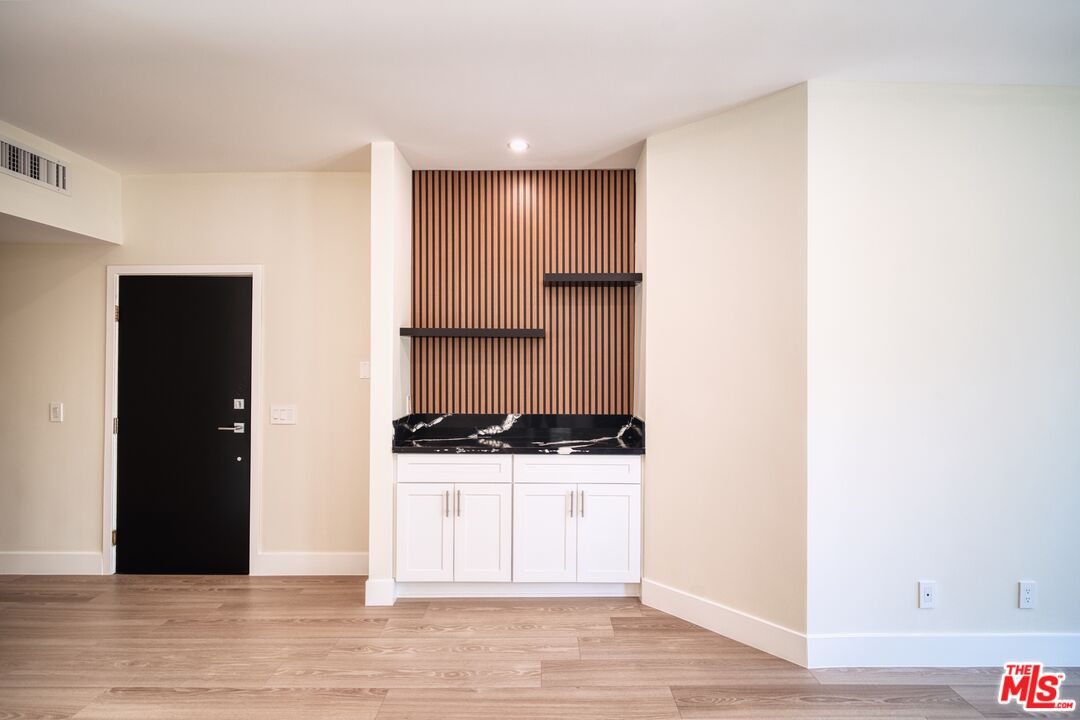 13920 Moorpark Street, Unit 201 Sherman Oaks, CA 91423 - Photo 8 of 25 a view of a kitchen with a sink and cabinets