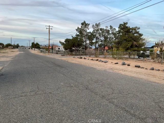 a view of a road with a building in the background