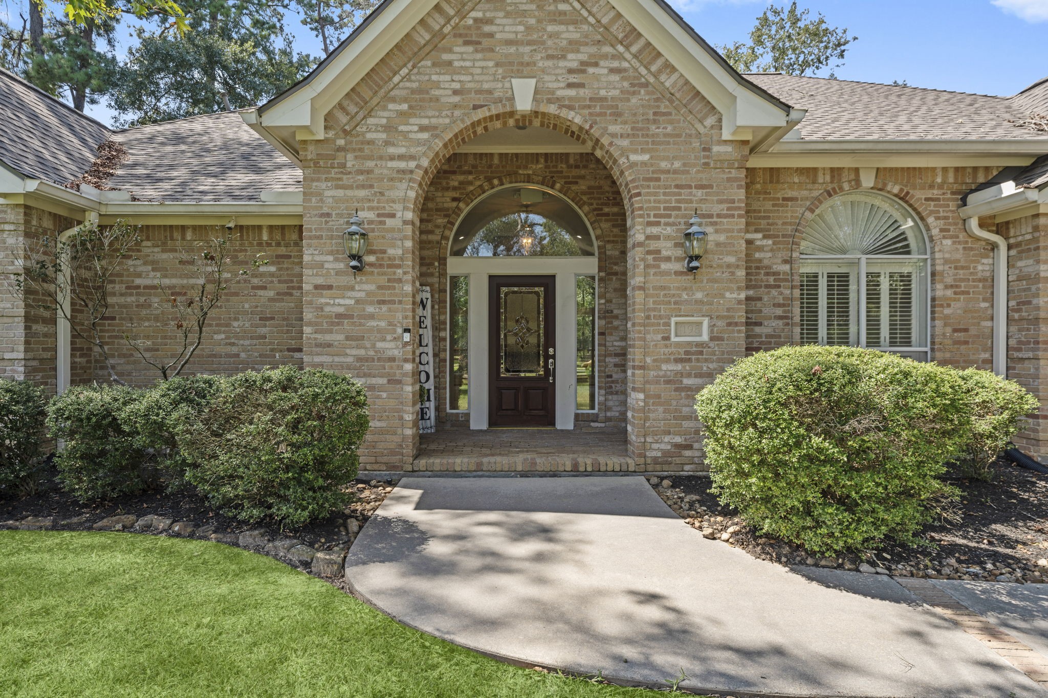 15456 Pin Oak Drive Conroe, TX 77384 - Photo 11 of 44 a view of a brick house with a large windows
