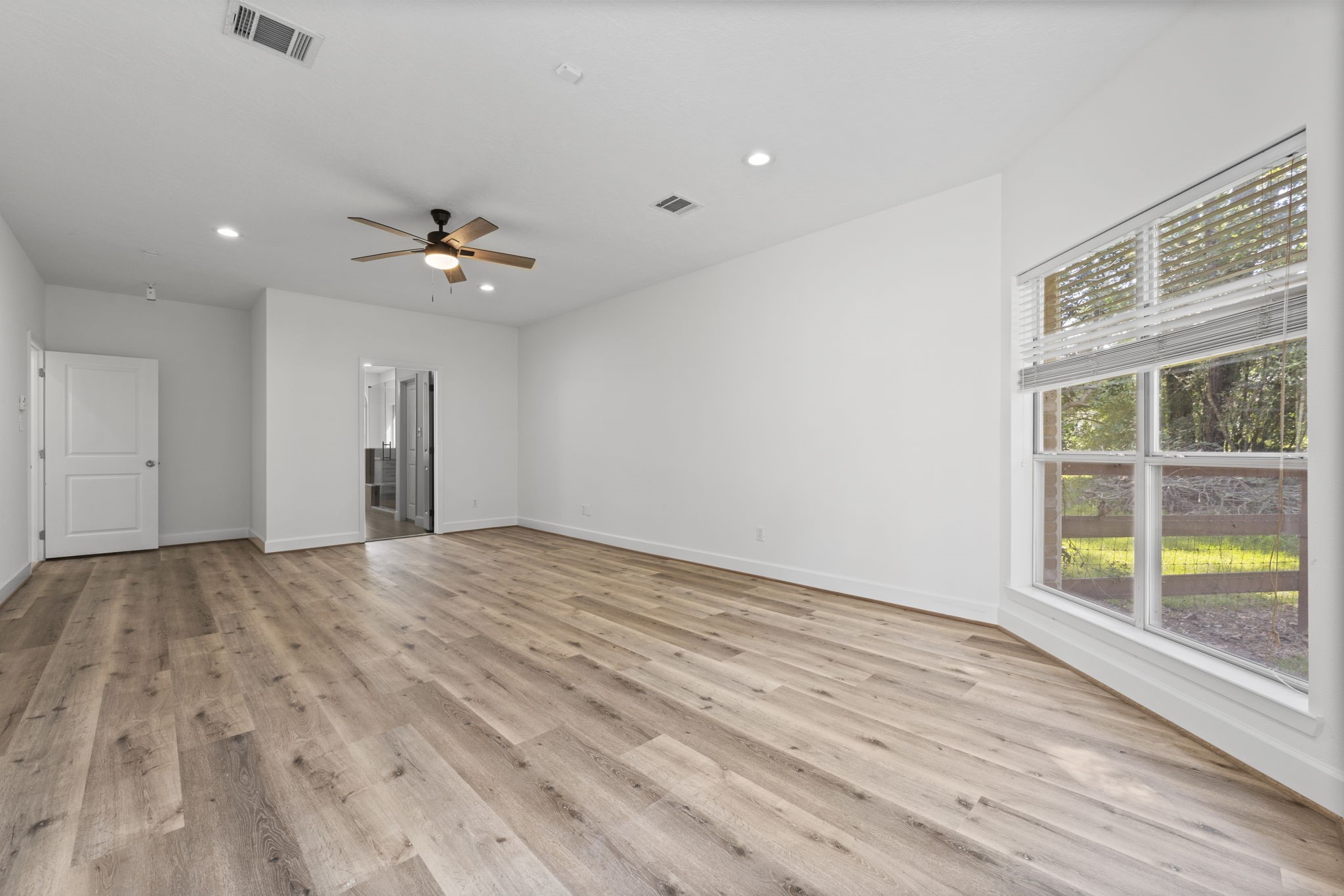 15456 Pin Oak Drive Conroe, TX 77384 - Photo 23 of 44 a view of an empty room with a window