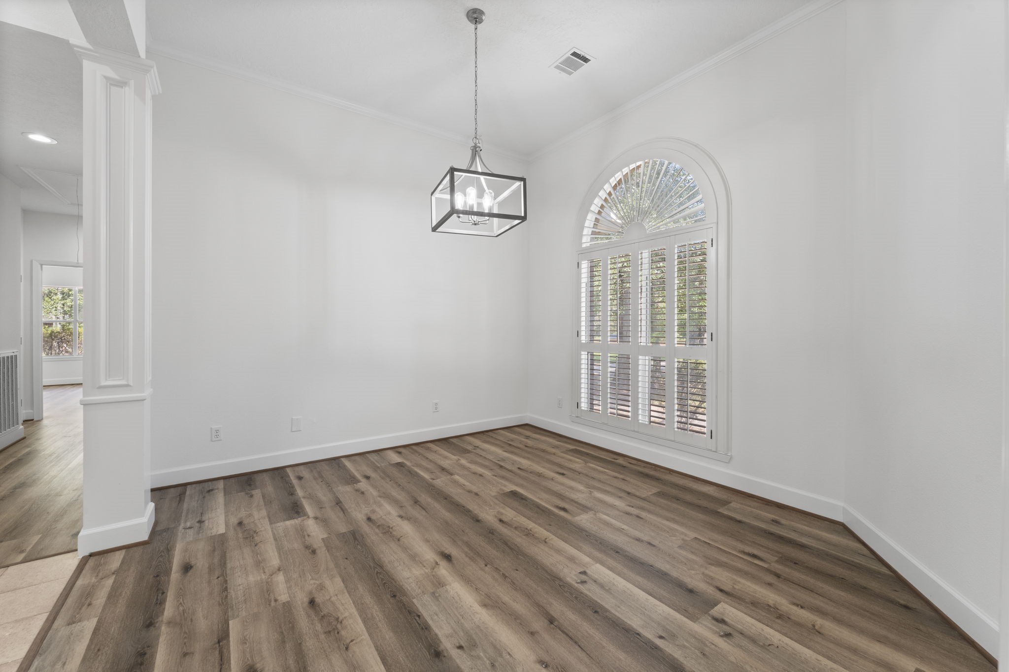 15456 Pin Oak Drive Conroe, TX 77384 - Photo 29 of 44 a view of a room with wooden floor white walls and windows