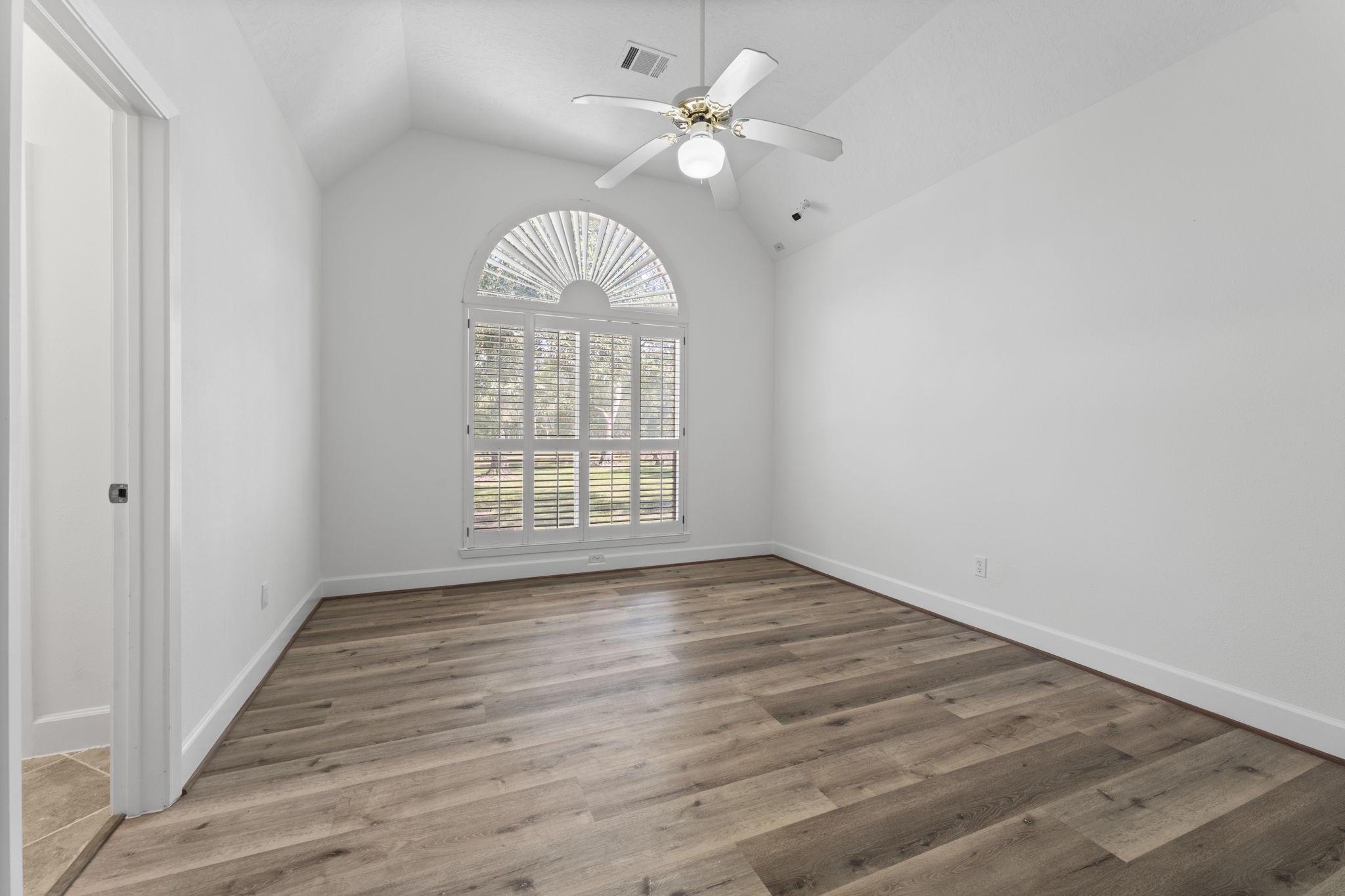 15456 Pin Oak Drive Conroe, TX 77384 - Photo 30 of 44 wooden floor in an empty room with a window