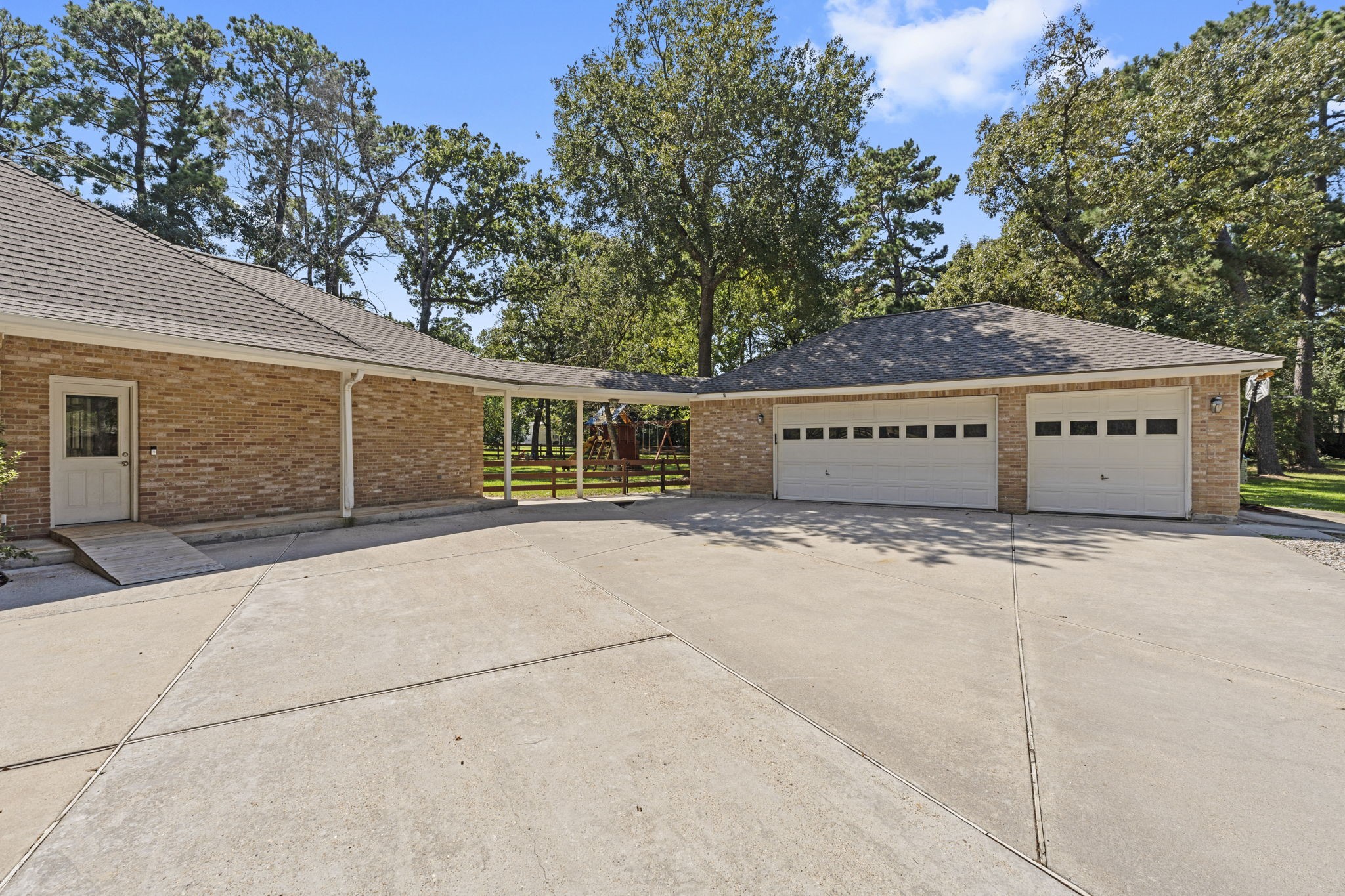 15456 Pin Oak Drive Conroe, TX 77384 - Photo 38 of 44 a view of a house with a garage