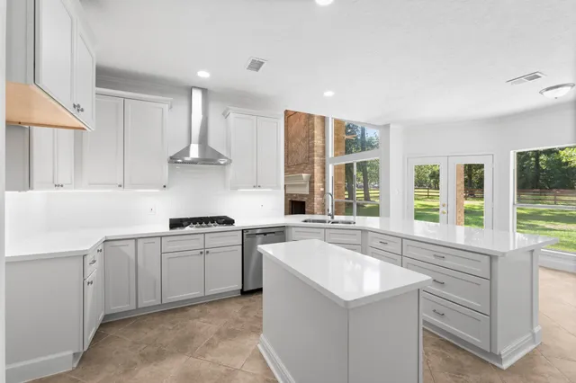 a kitchen with a sink stove and cabinets