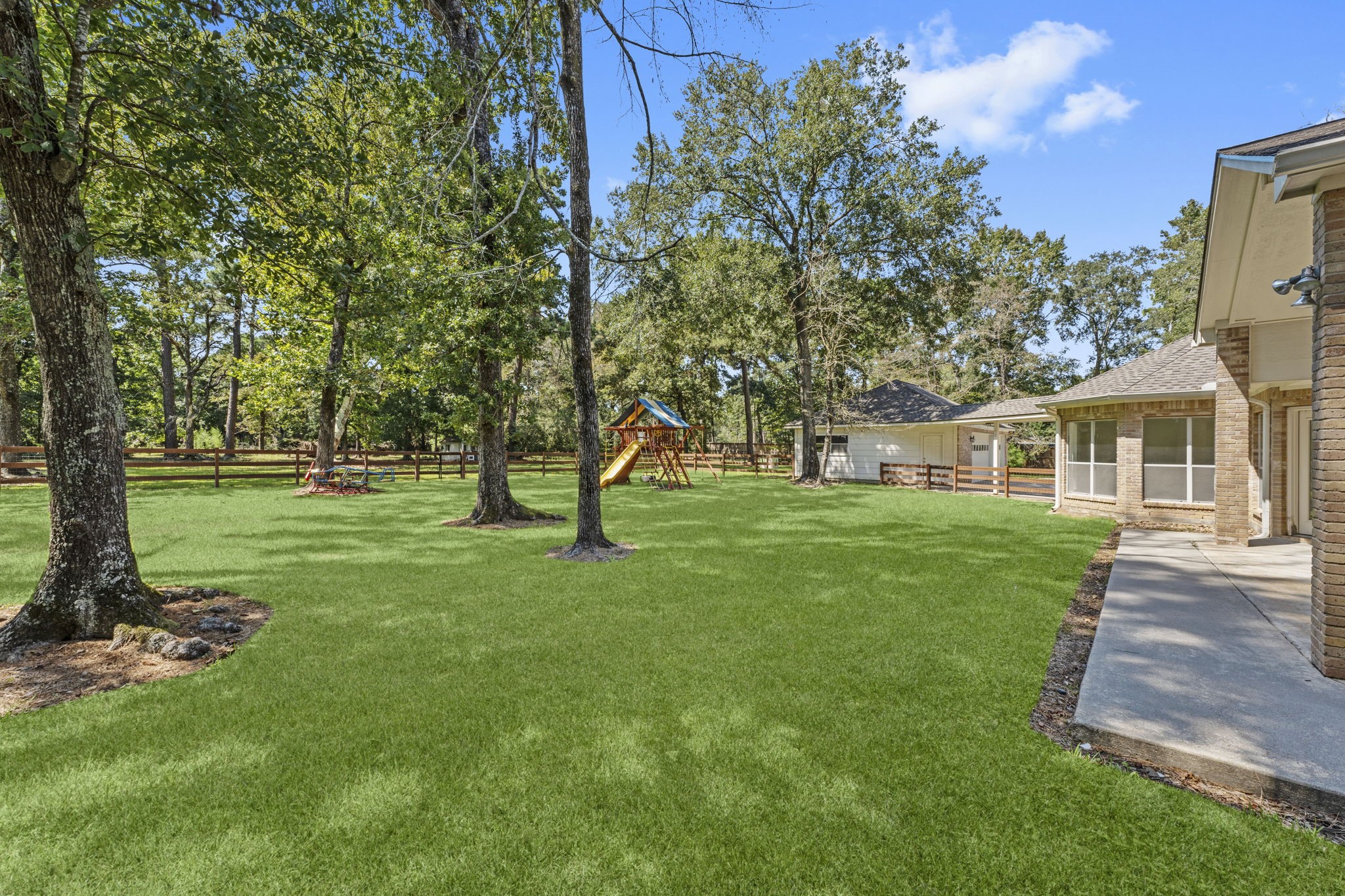 15456 Pin Oak Drive Conroe, TX 77384 - Photo 43 of 44 a view of a house with a yard