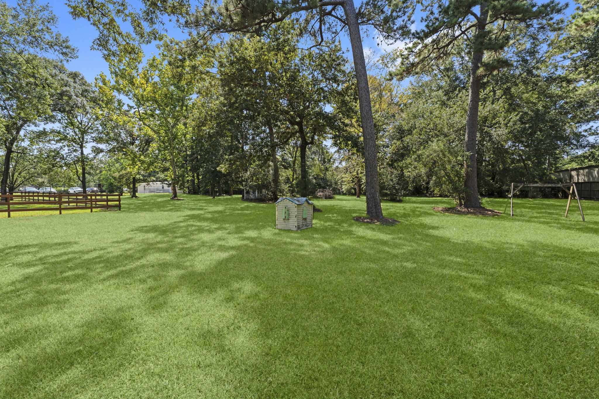 15456 Pin Oak Drive Conroe, TX 77384 - Photo 8 of 44 a garden with trees in the background