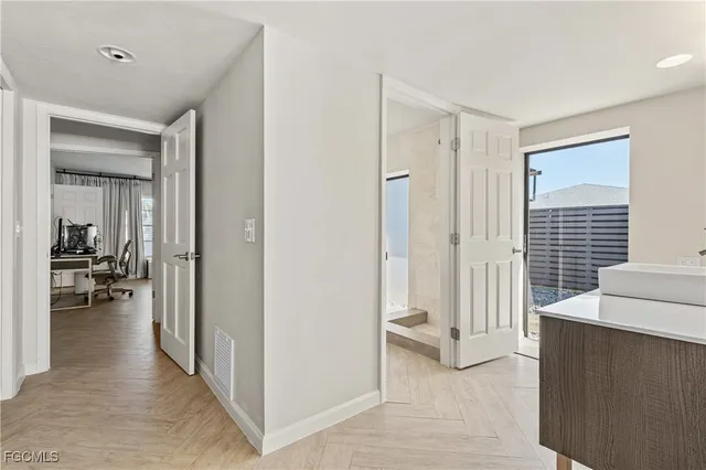 a view of a livingroom with tub and dining room view