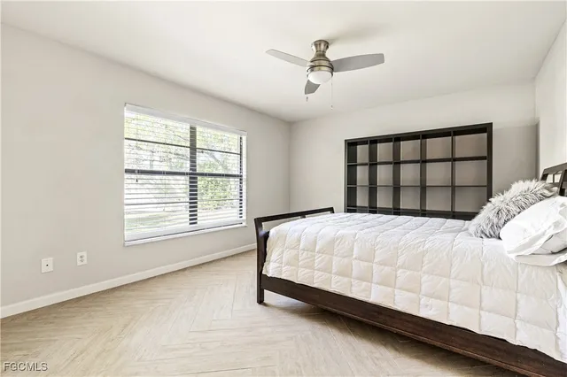 a bedroom with a bed and window