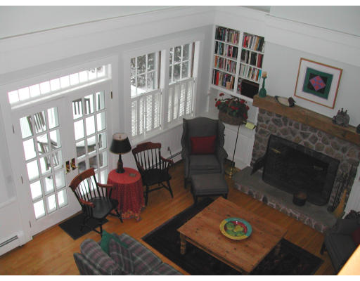 188 Grove Street Wellesley, MA 02482 - Photo 12 of 15 a living room with furniture wooden floor and a fireplace