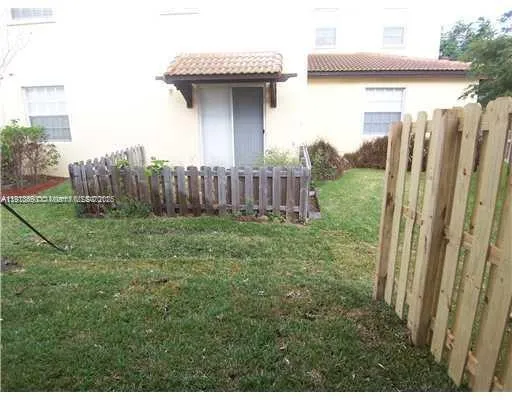 a view of a backyard with plants