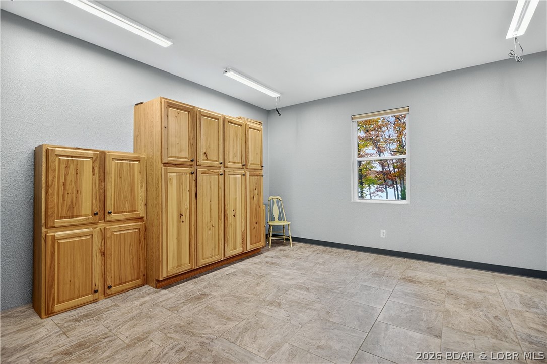 331 Hollow Oak Road Sunrise Beach, MO 65079 - Photo 39 of 66 Finished room off the garage, perfect for storage,