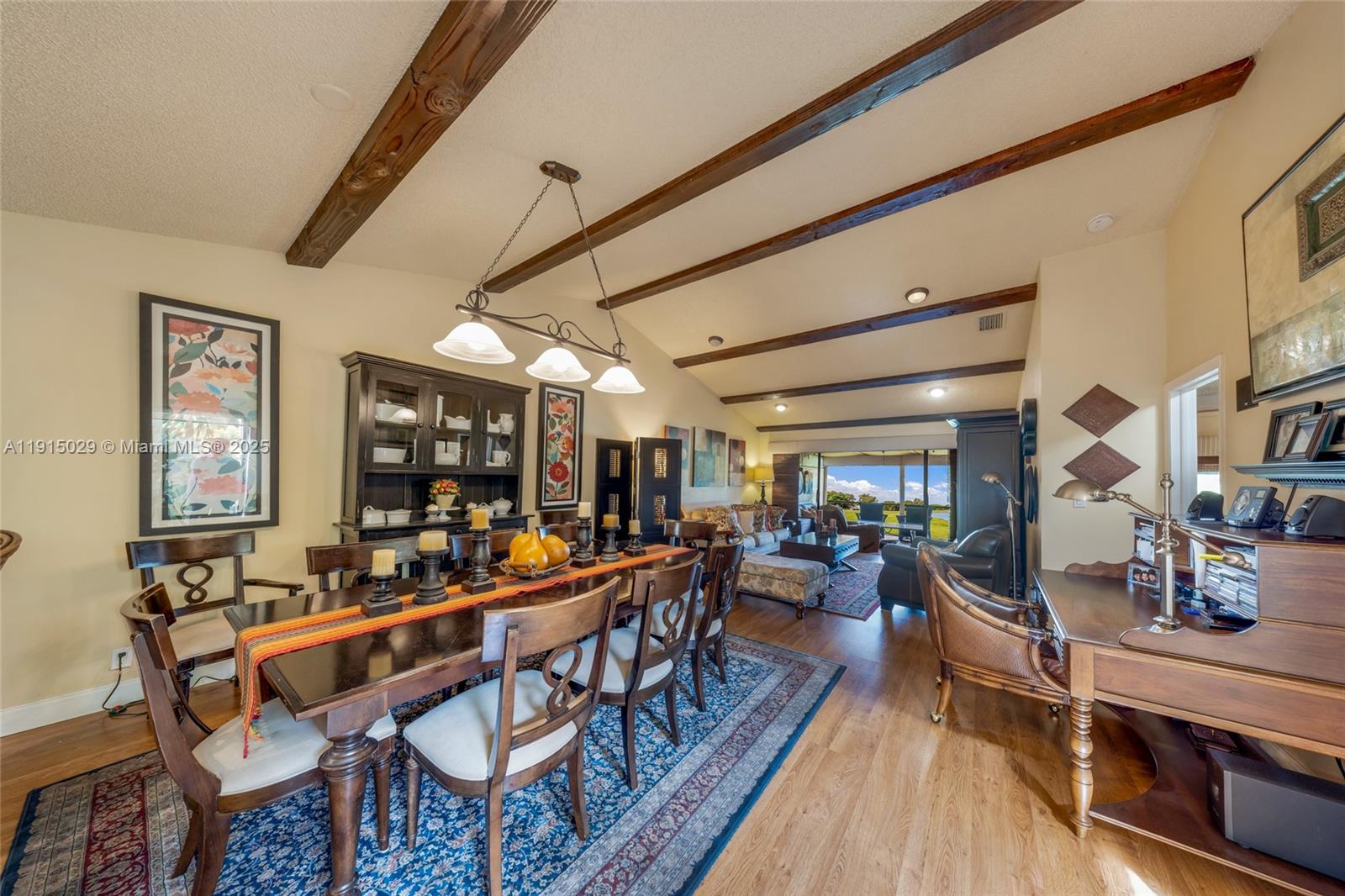 16175 Laurel Drive, Unit 27 Weston, FL 33326 - Photo 4 of 22 a outdoor space with lots of tables a large window and chairs