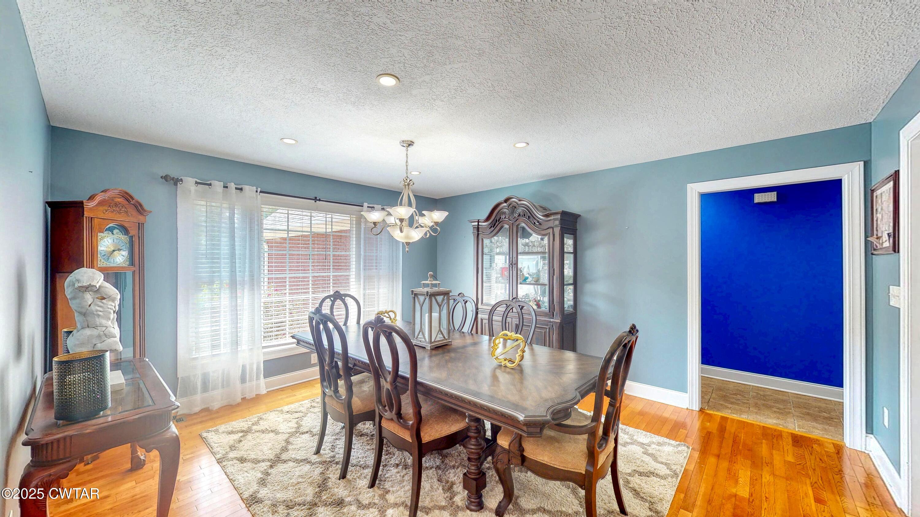2345 East Grove Road Gleason, TN 38229 - Photo 12 of 44 a view of a dining room with furniture and chandelier