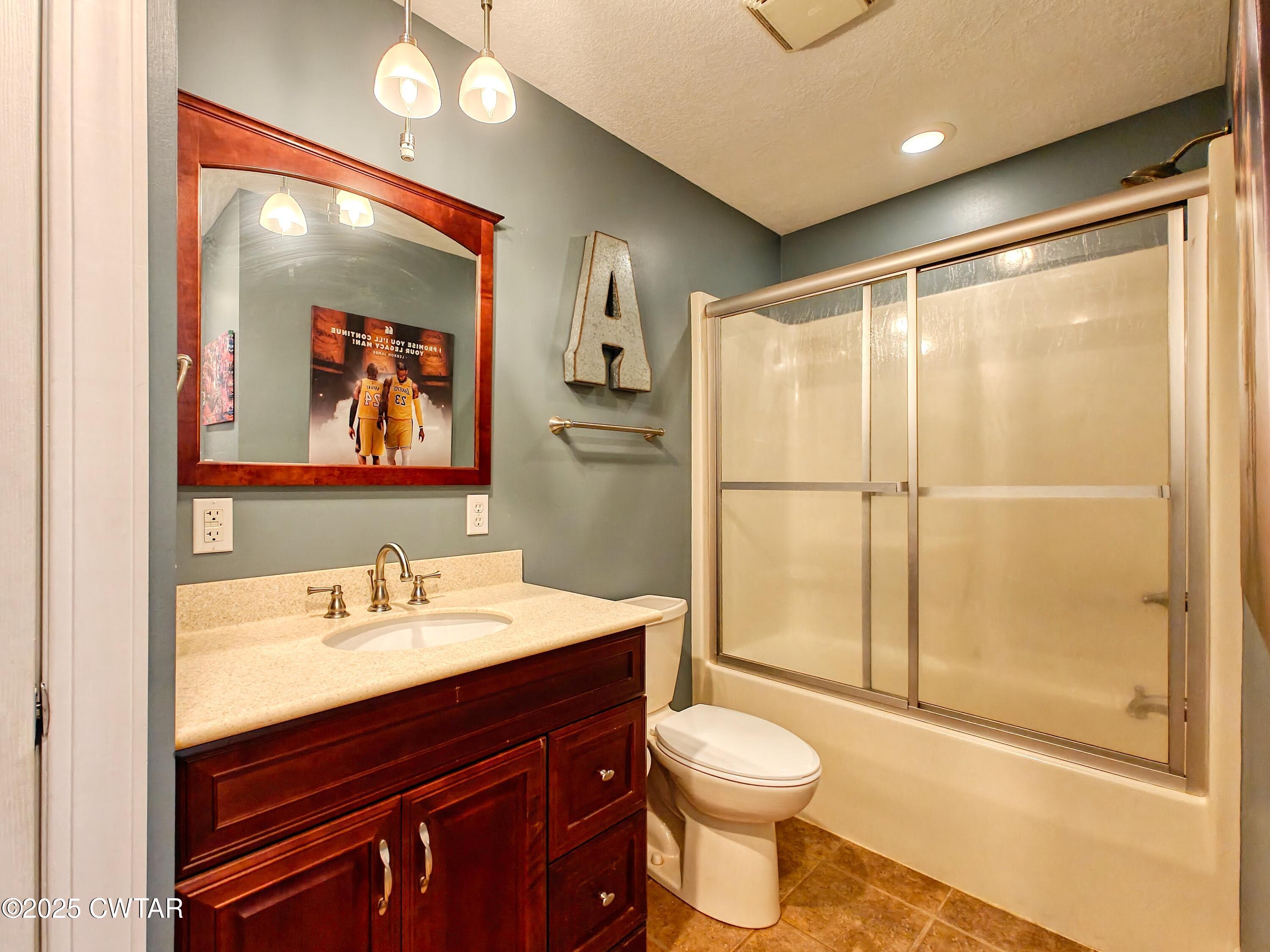 2345 East Grove Road Gleason, TN 38229 - Photo 24 of 44 a bathroom with a sink a toilet and shower