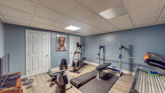 a bathroom with a granite countertop toilet a sink and a mirror
