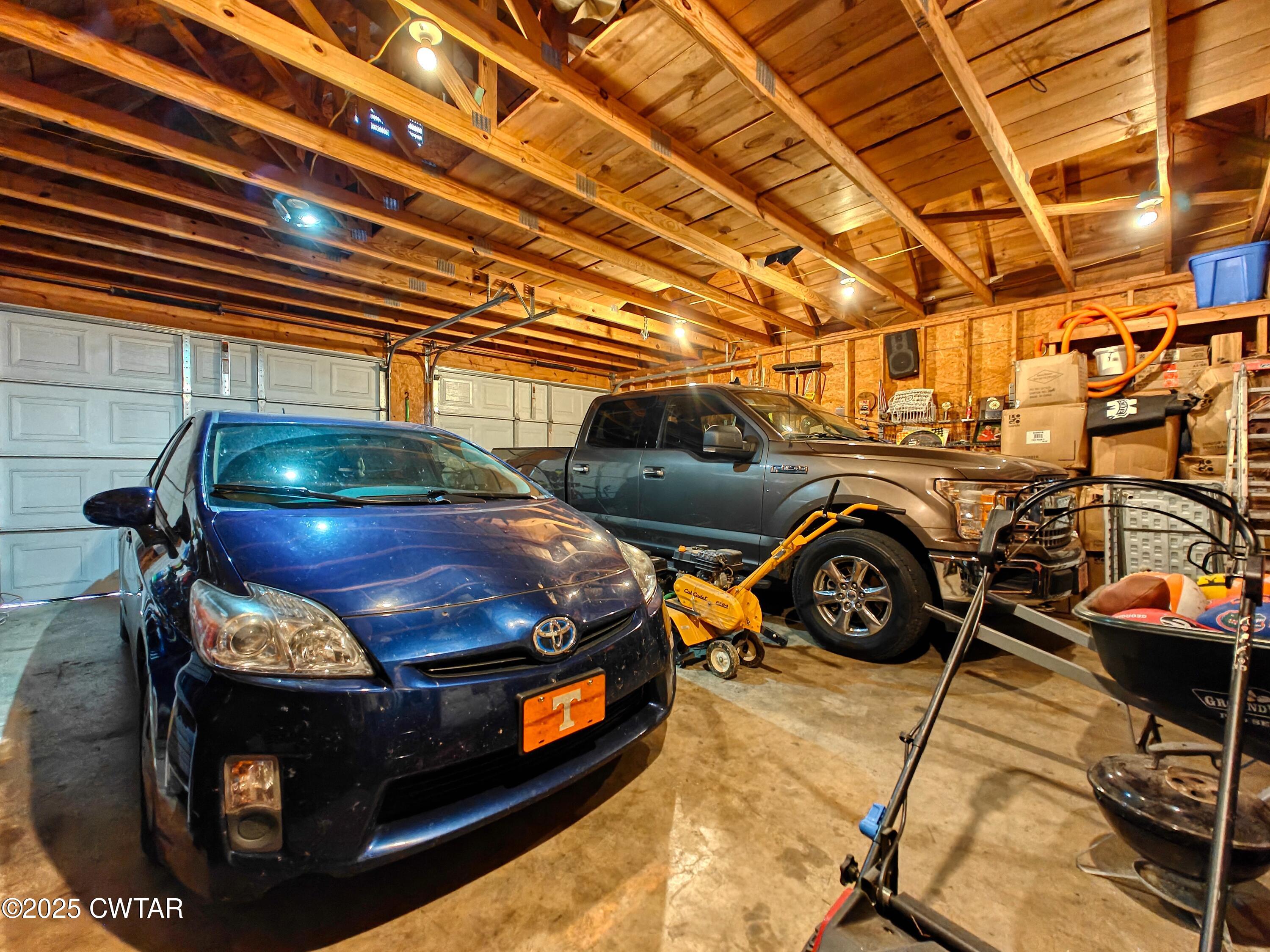 2345 East Grove Road Gleason, TN 38229 - Photo 30 of 44 a car parked in a garage
