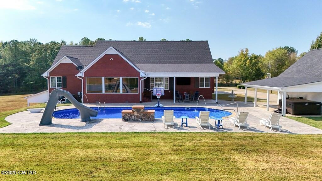 2345 East Grove Road Gleason, TN 38229 - Photo 31 of 44 a view of a swimming pool with chairs and a table