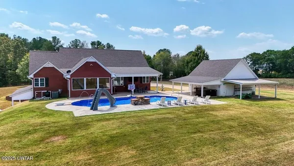 a view of a swimming pool with a patio