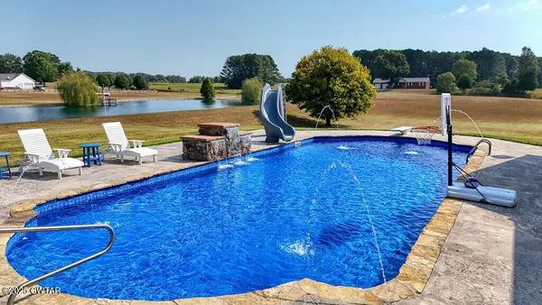 a view of a swimming pool with an ocean view