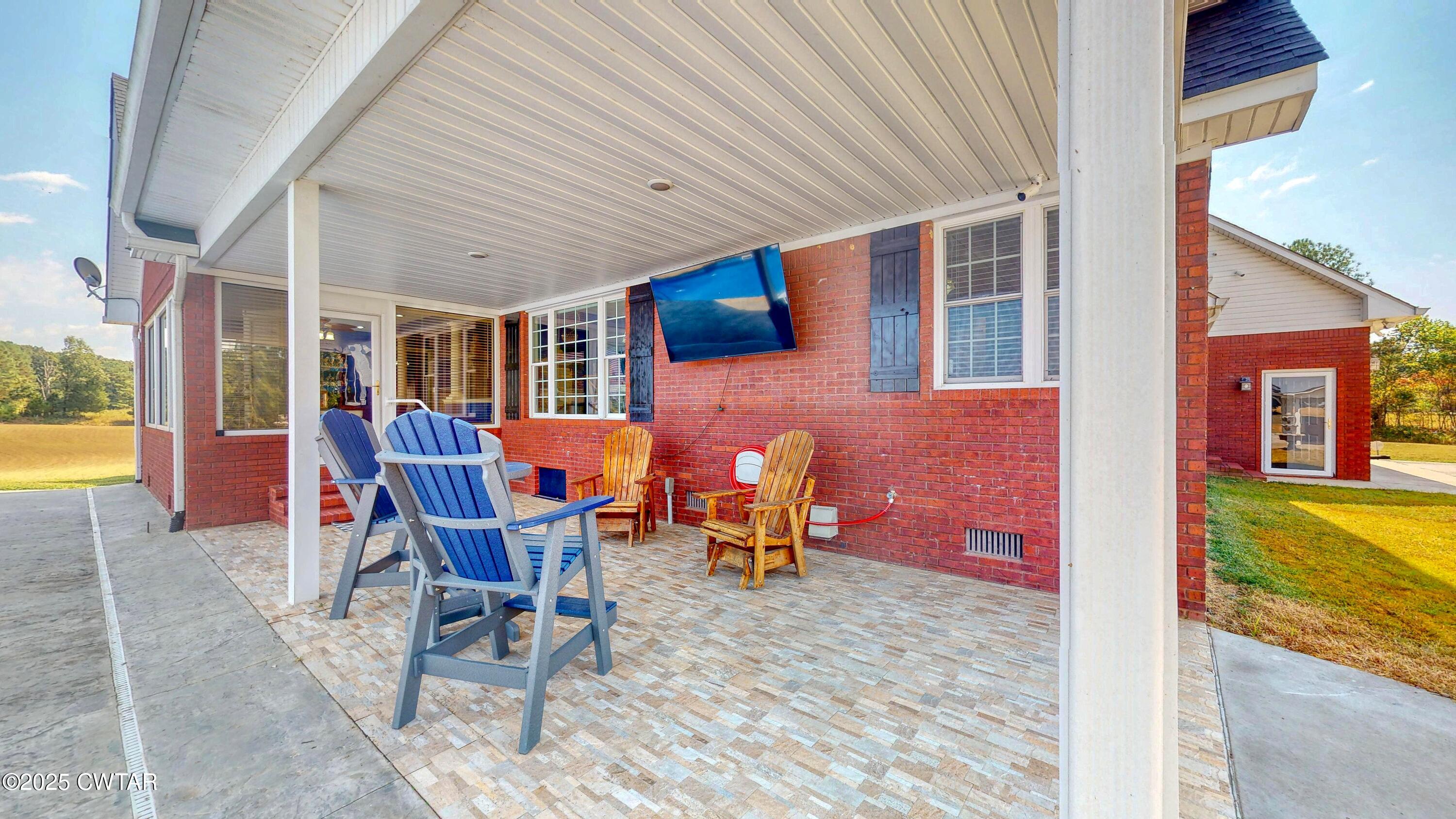 2345 East Grove Road Gleason, TN 38229 - Photo 38 of 44 a view of a patio with a table and chairs