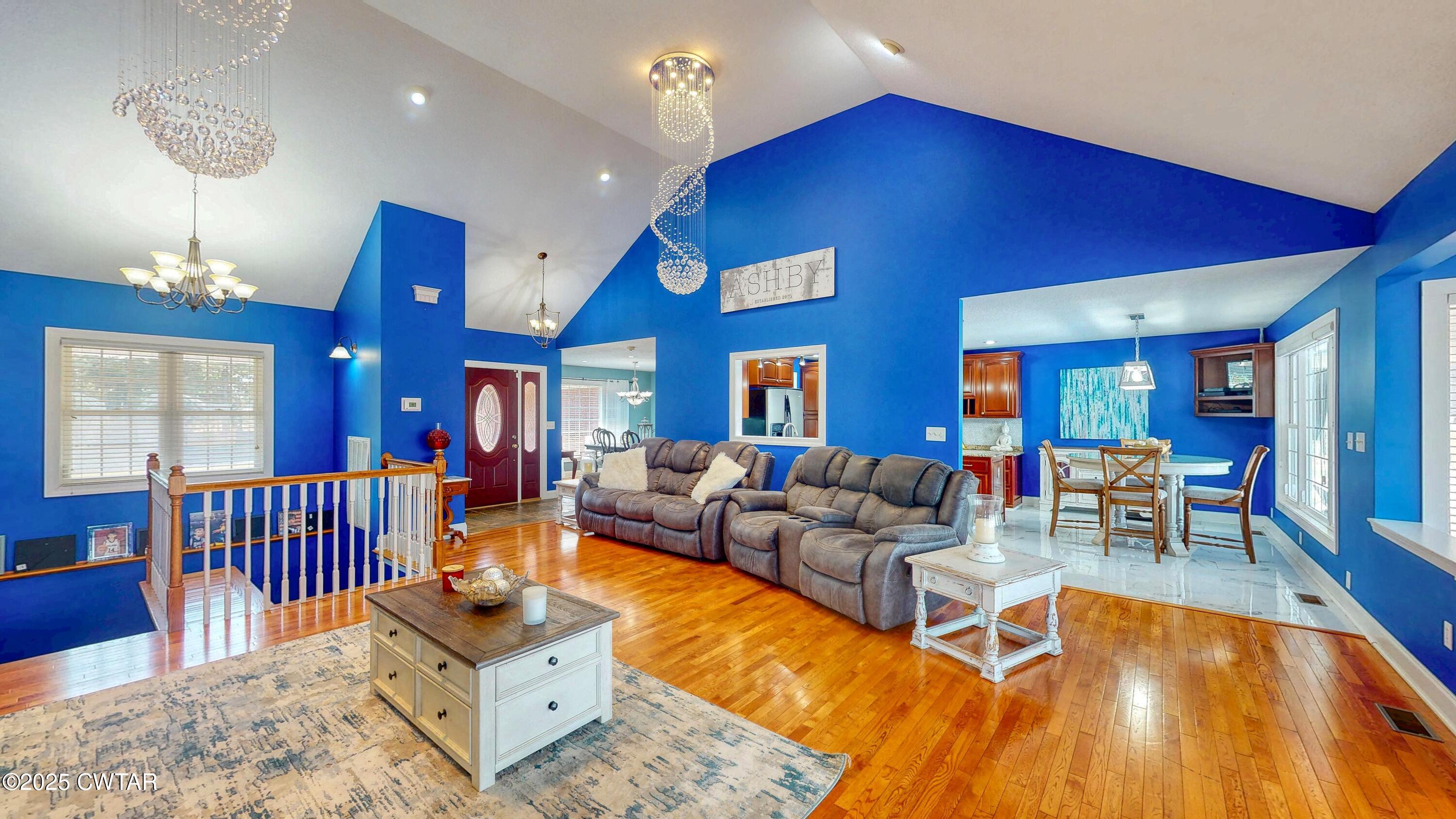 2345 East Grove Road Gleason, TN 38229 - Photo 7 of 44 a living room with furniture a chandelier and a dining table