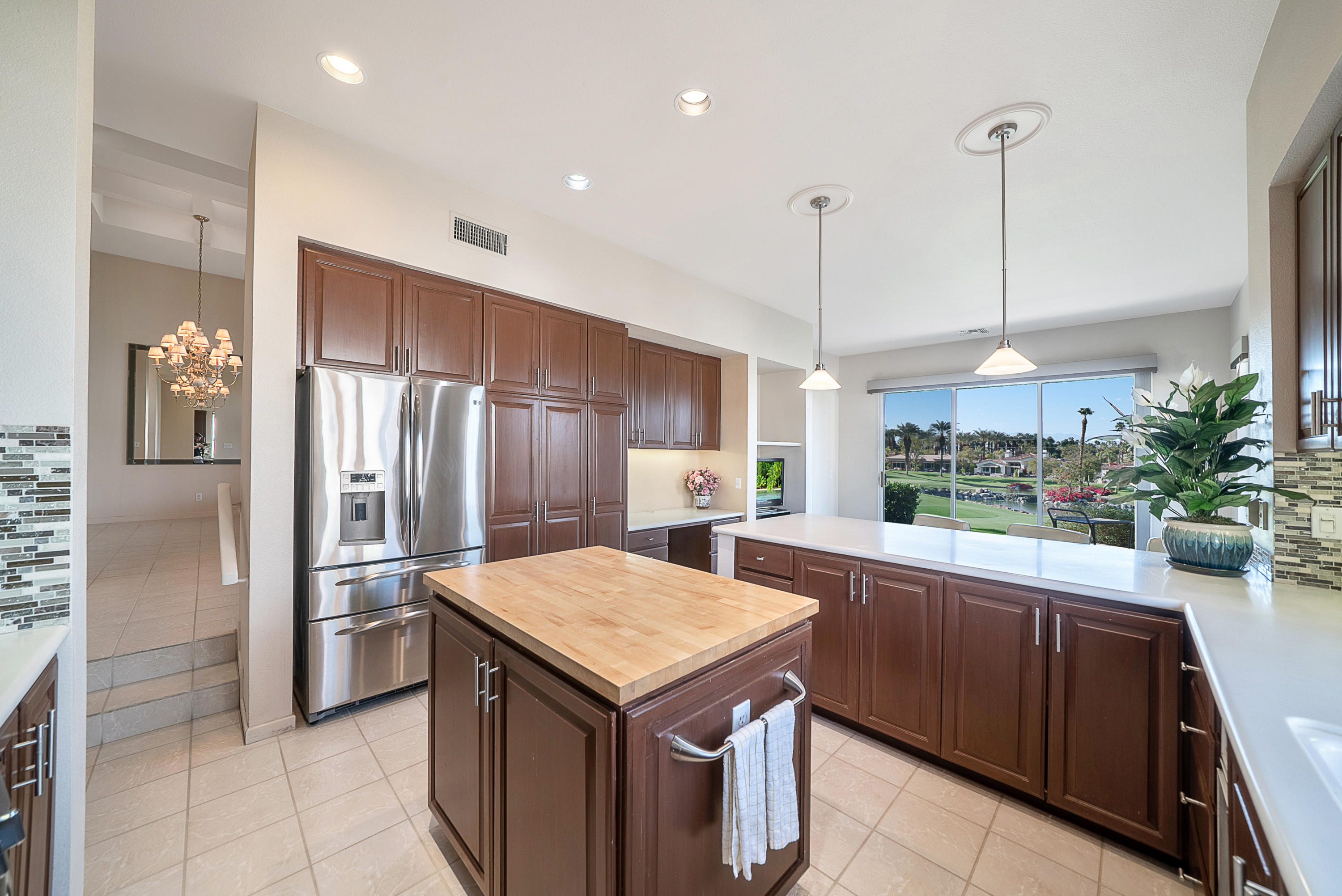 500 Red Arrow Trail Palm Desert, CA 92211 - Photo 18 of 60 a kitchen with a refrigerator a sink and dishwasher