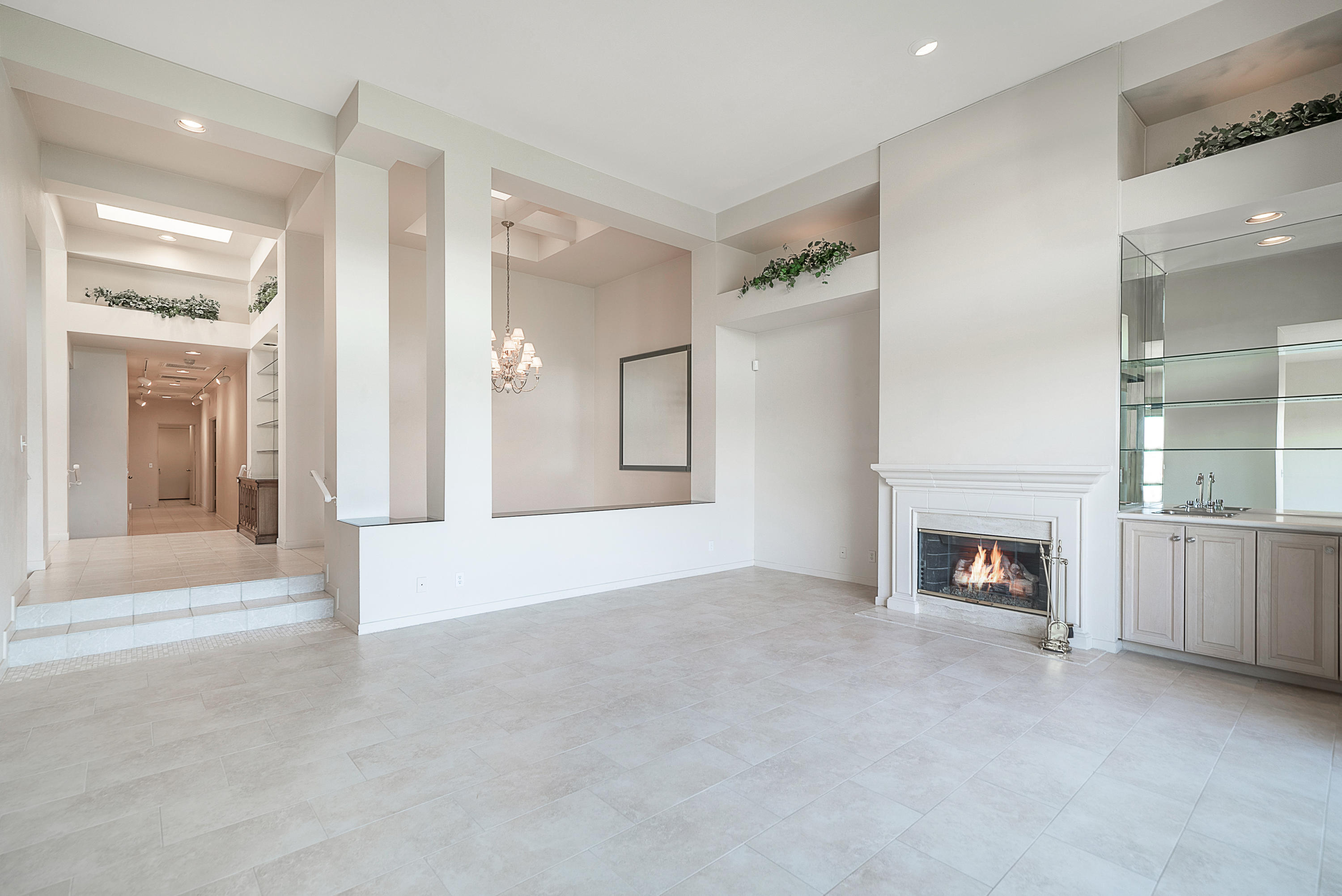 500 Red Arrow Trail Palm Desert, CA 92211 - Photo 30 of 60 a view of a livingroom with a fireplace cabinet and window