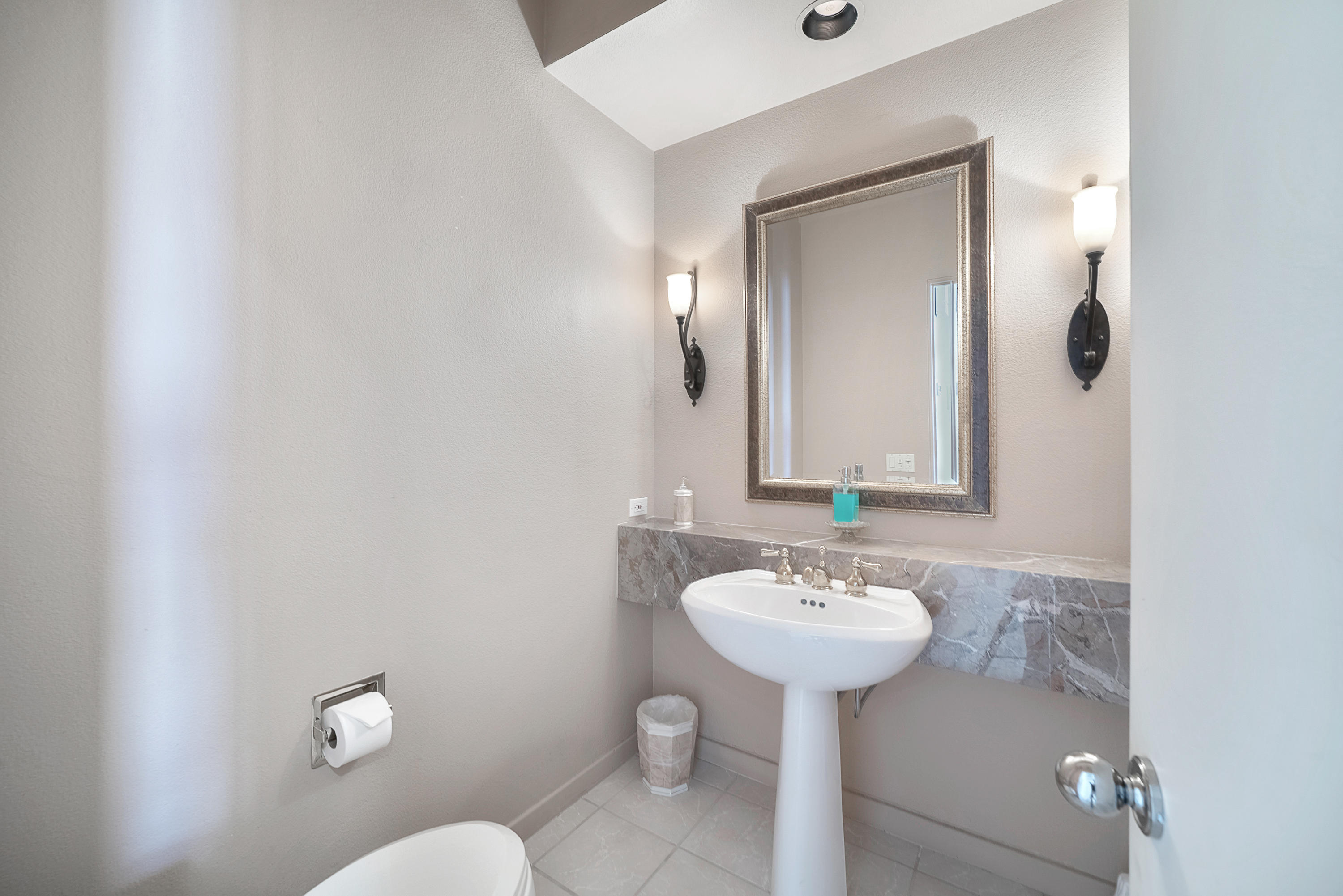 500 Red Arrow Trail Palm Desert, CA 92211 - Photo 31 of 60 a bathroom with a sink mirror and toilet