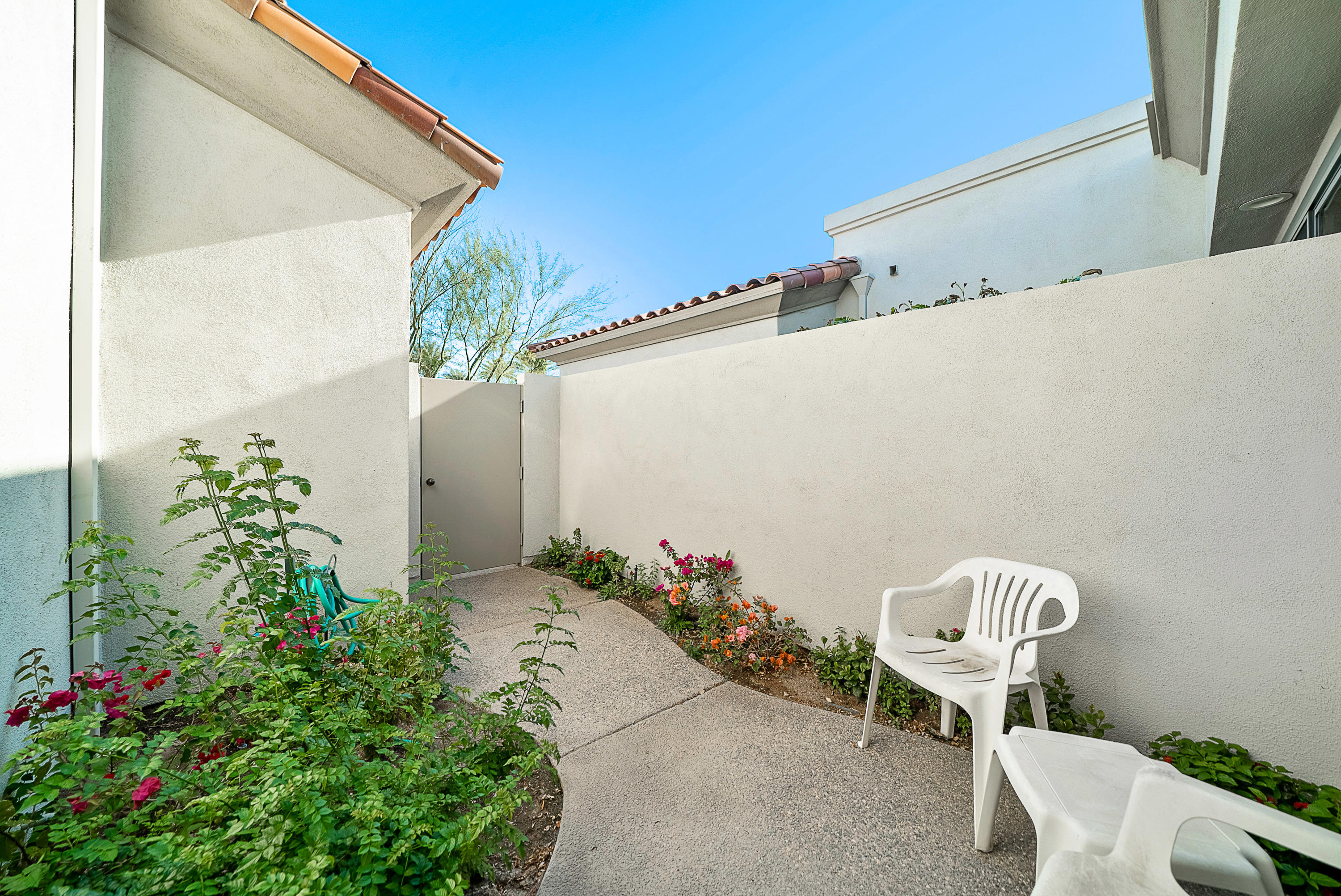 500 Red Arrow Trail Palm Desert, CA 92211 - Photo 39 of 60 a front view of a house with garden