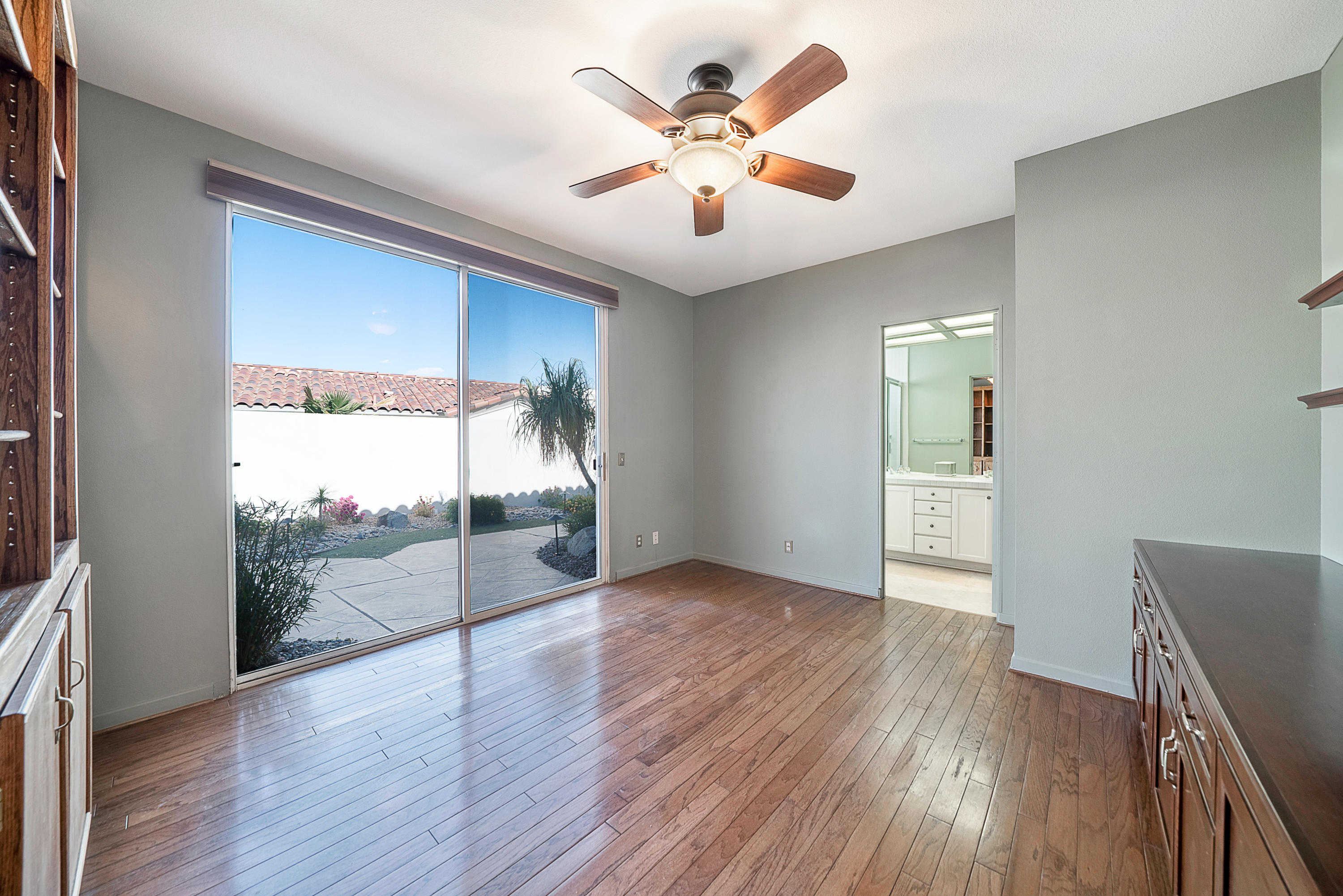 500 Red Arrow Trail Palm Desert, CA 92211 - Photo 40 of 60 a view of an empty room with wooden floor and a window