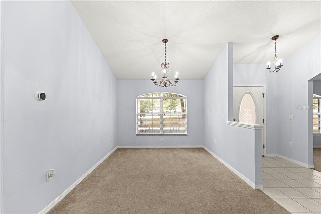 21595 Southwest 84th Loop Dunnellon, FL 34431 - Photo 11 of 62 wooden floor in an empty room with a window