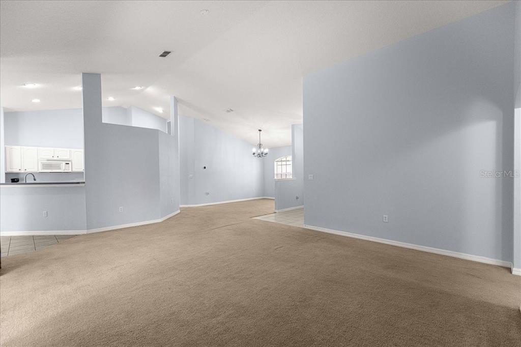 21595 Southwest 84th Loop Dunnellon, FL 34431 - Photo 23 of 62 a view of a kitchen with a sink and a refrigerator