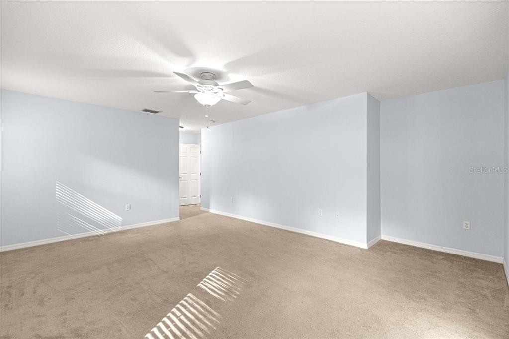 21595 Southwest 84th Loop Dunnellon, FL 34431 - Photo 32 of 62 a view of an empty room with a chandelier fan