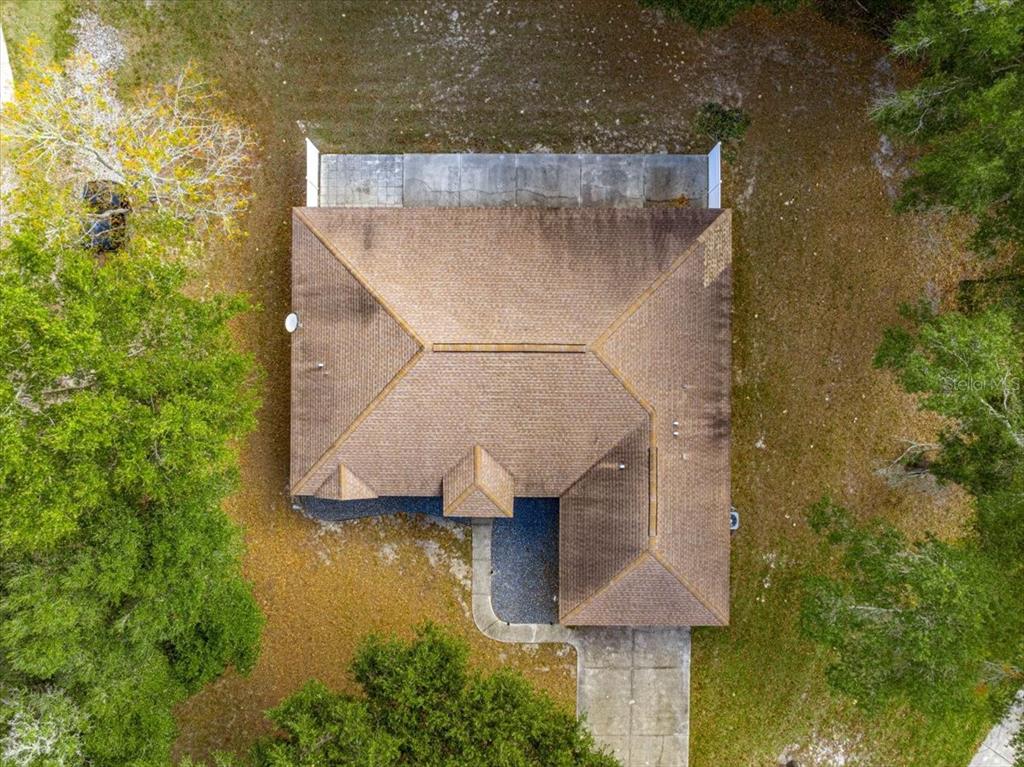 21595 Southwest 84th Loop Dunnellon, FL 34431 - Photo 62 of 62 an aerial view of a house with pool patio and outdoor seating