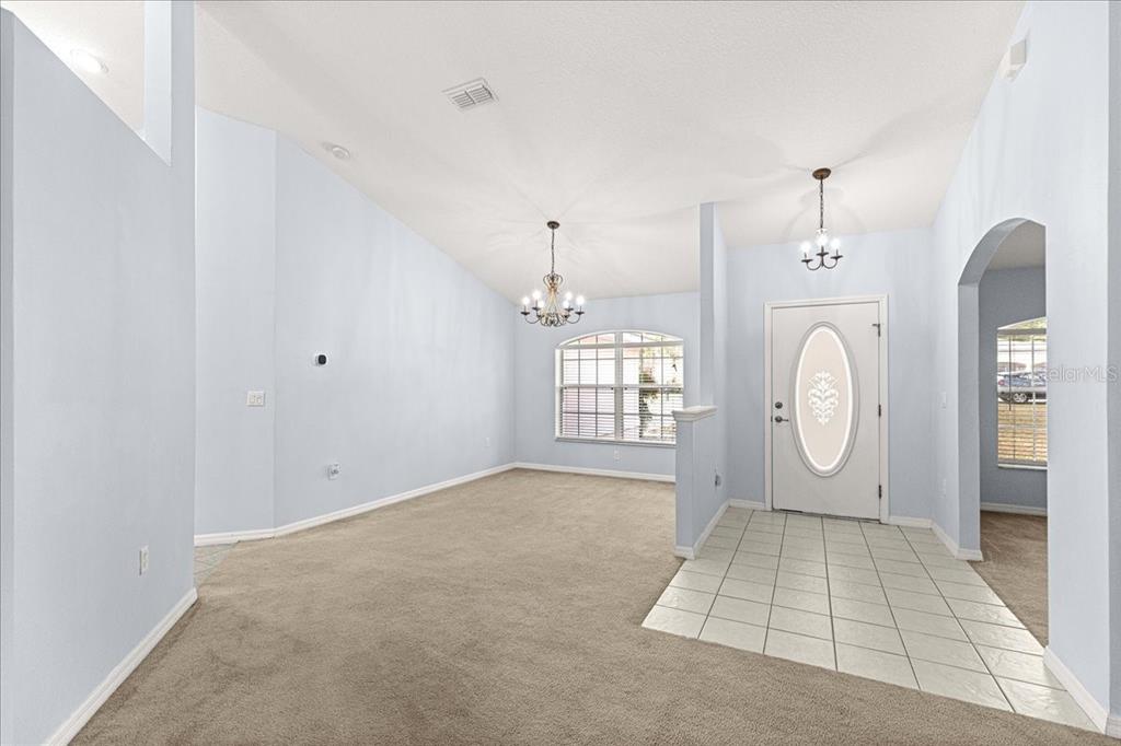 21595 Southwest 84th Loop Dunnellon, FL 34431 - Photo 9 of 62 a view of an empty room with window and mirror