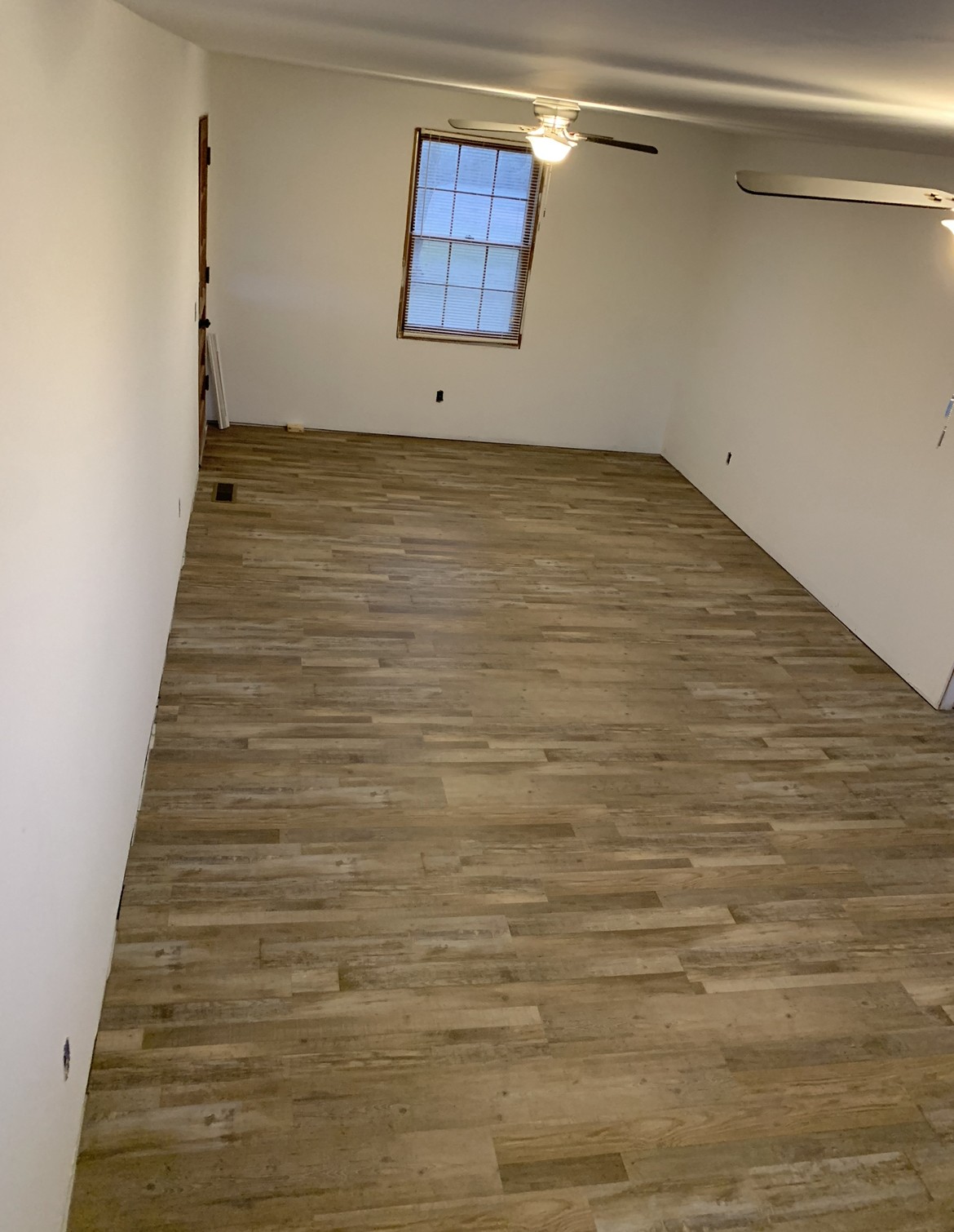 12663 Newtown Road Rockvale, TN 37153 - Photo 15 of 17 a view of a room with wooden floor and white walls