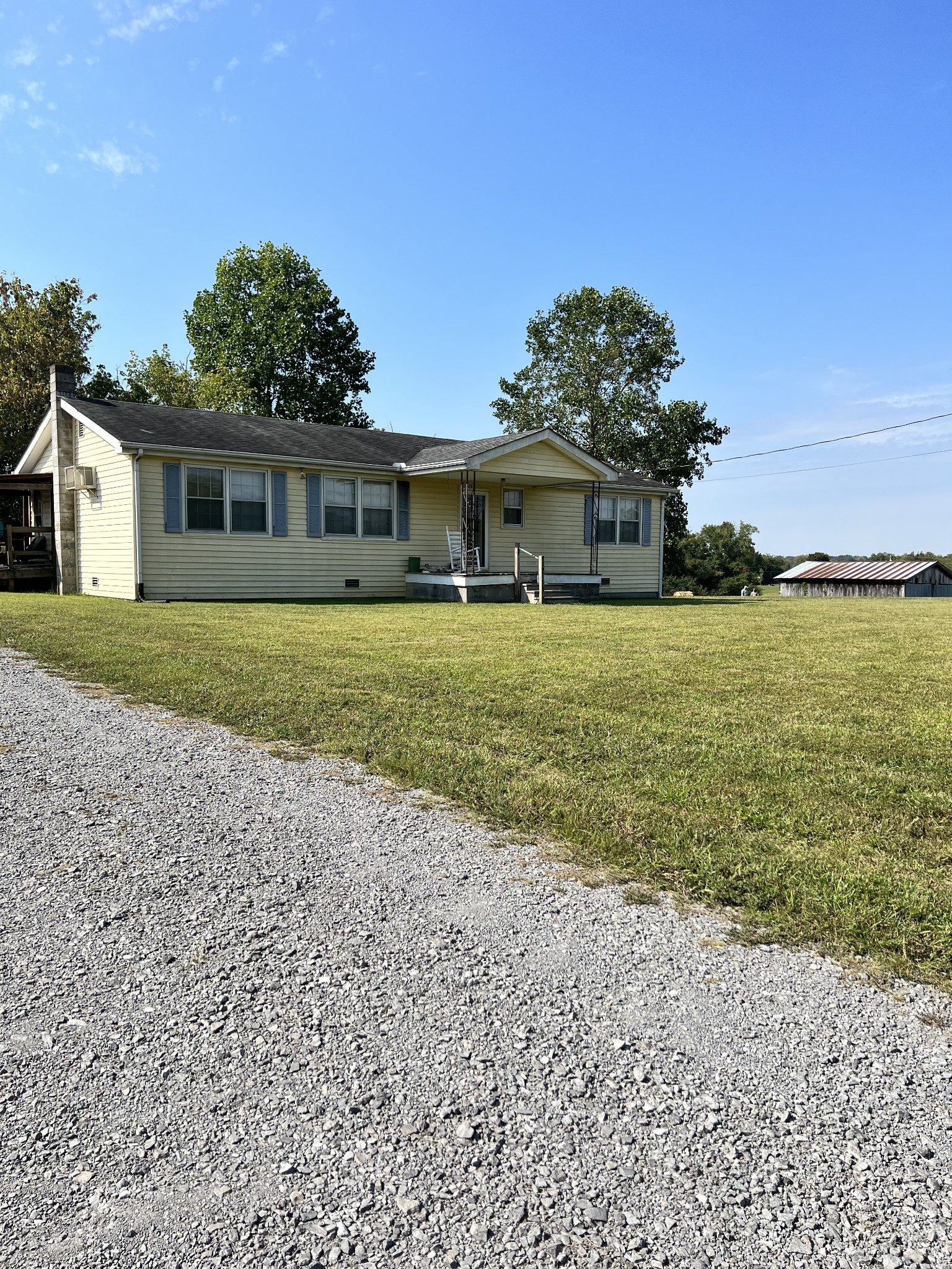 12663 Newtown Road Rockvale, TN 37153 - Photo 5 of 17 a front view of a house with a garden