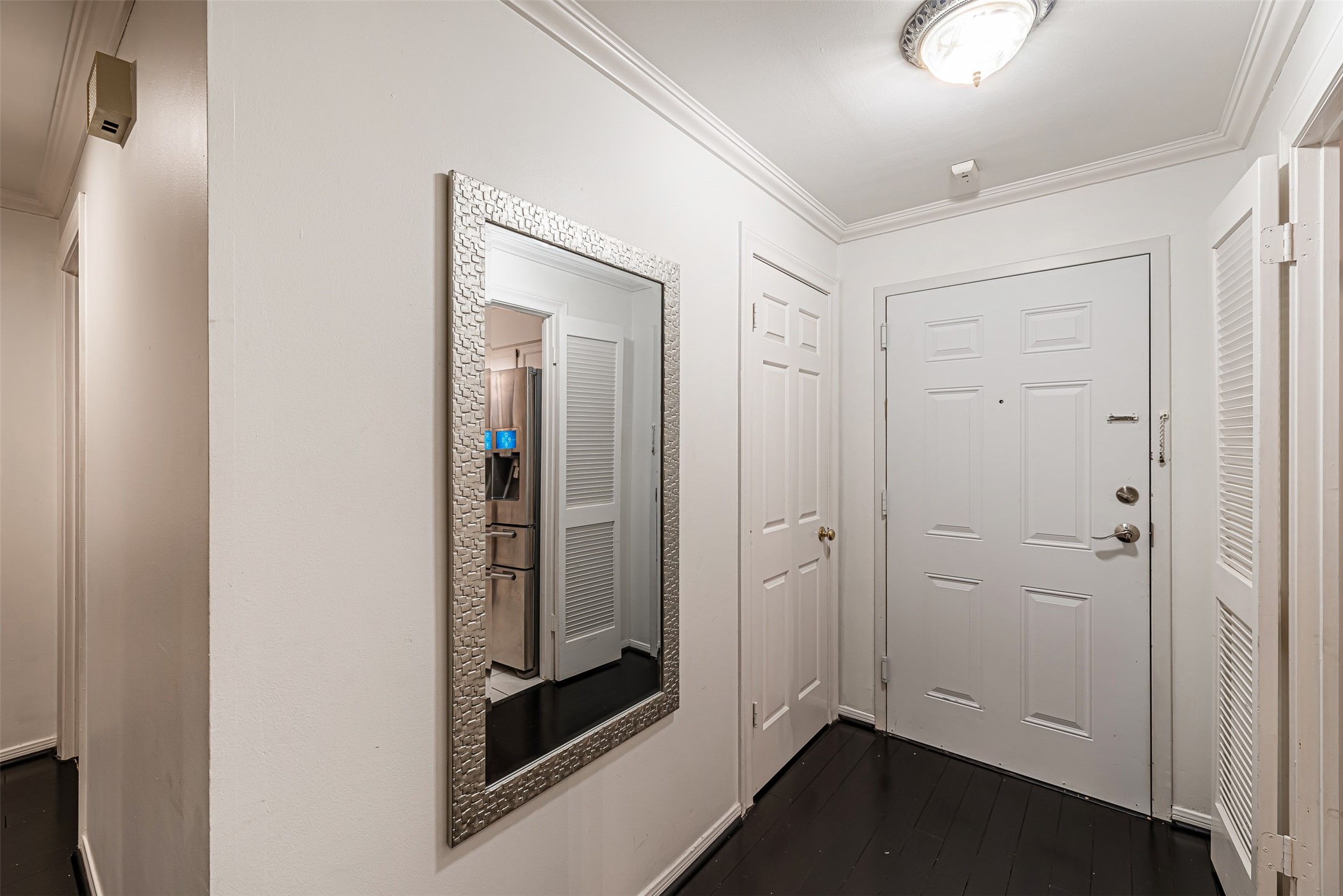 661 Bering Drive, Unit 404 Houston, TX 77057 - Photo 17 of 28 a view of an entryway with wooden floor