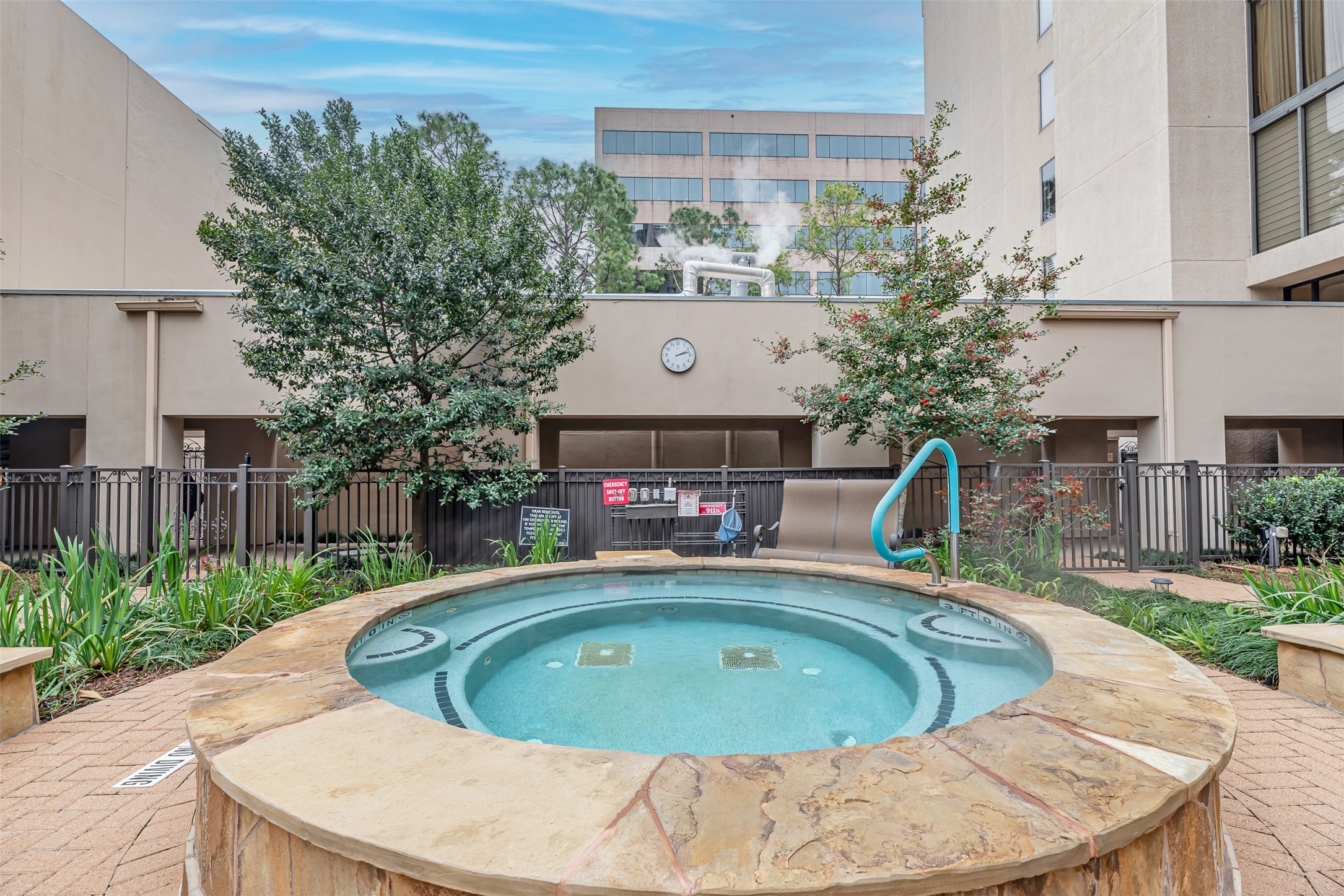 661 Bering Drive, Unit 404 Houston, TX 77057 - Photo 19 of 28 a view of a swimming pool with a patio